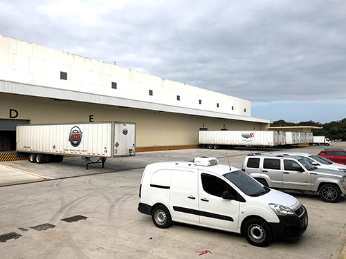 Trailers at loading dock of warehouse facility